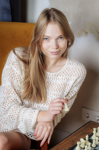 Luise plays with showed pussy in panties on a chair