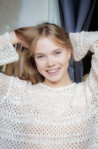 Luise plays with showed pussy in panties on a chair