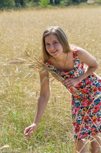 Ieva in a lacy field striptease, panties slid down, legs spread