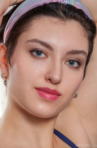 Chantal Parts Her Thighs To Expose The Intricate Folds Of Her Shaved Pussy