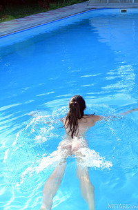 Alina Splashing Around In The Water Playfully
