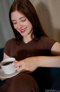 Marion Summers Relaxes In Armchair With Yoga Pants In Cozy Living Room Glow