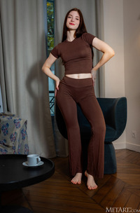 Marion Summers Relaxes In Armchair With Yoga Pants In Cozy Living Room Glow