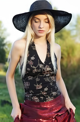 Skinny blonde Kira shows her small boobs and tight ass outdoor