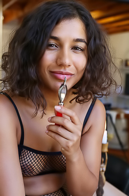 Rubi displays her kinky fishnet lingerie