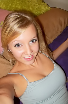 Blonde girlfriend takes selfshot pictures in bed of her perky teenage tits