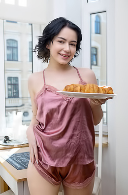 Baiba Rose-colored Silk Camisole That Skims Over Her Lovely Breasts