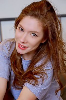 Sata Jones Voluptuous Beauty Smiles Seductively As She Spreads Her Long Legs In A Wide Split