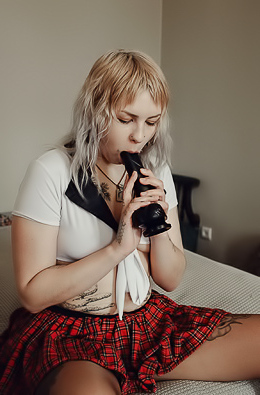 Sem Retlick Grabs Her Ass Enticingly In A Plaid Skirt And Black Pantyhose
