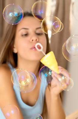 Baby Shine Slim brunette undresses when playing with soap bubbles