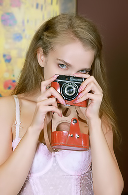 Xenia Glancing Back Over Her Shoulder With A Flirtatious Smile