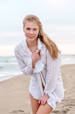 Luise Entices With A Beach Striptease Revealing Perky Nipples And Grabbing Her Curves