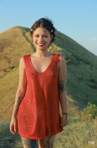 Lilith Baph Climbs For Pleasure Amid Sunsets Glow On Hilltop